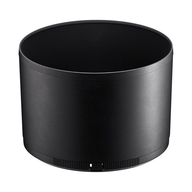 Black cylindrical lens hood shown from front angle, displaying ribbed interior surface and focus ring grooves at base.