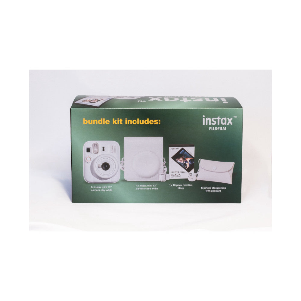 Green product packaging box displaying contents: white Instax Mini 13 camera, white camera case, black film pack, and white storage bag with pendant.