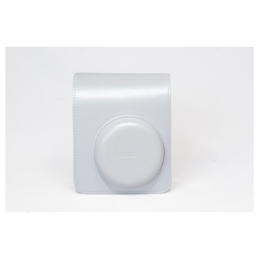 White Instax Mini 13 camera case with circular lens opening and embossed branding, shown against light gray background.