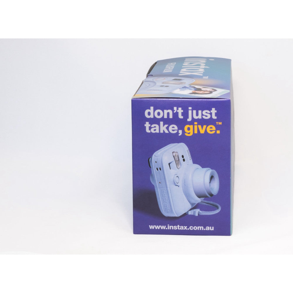 Blue Instax Mini 13 camera box displayed at an angle showing the purple packaging with "don't just take, give" slogan and product image.