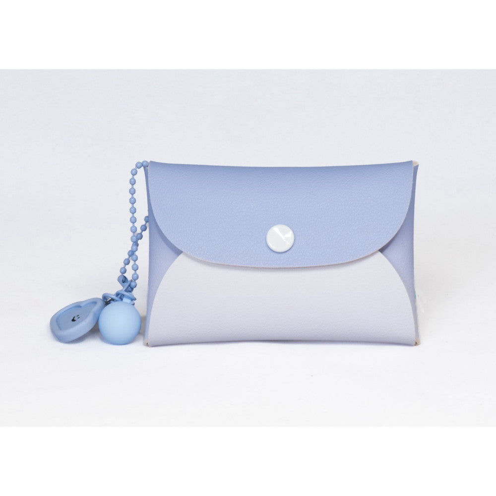 Blue and white camera case with matching keychain accessories displayed against a light background.
