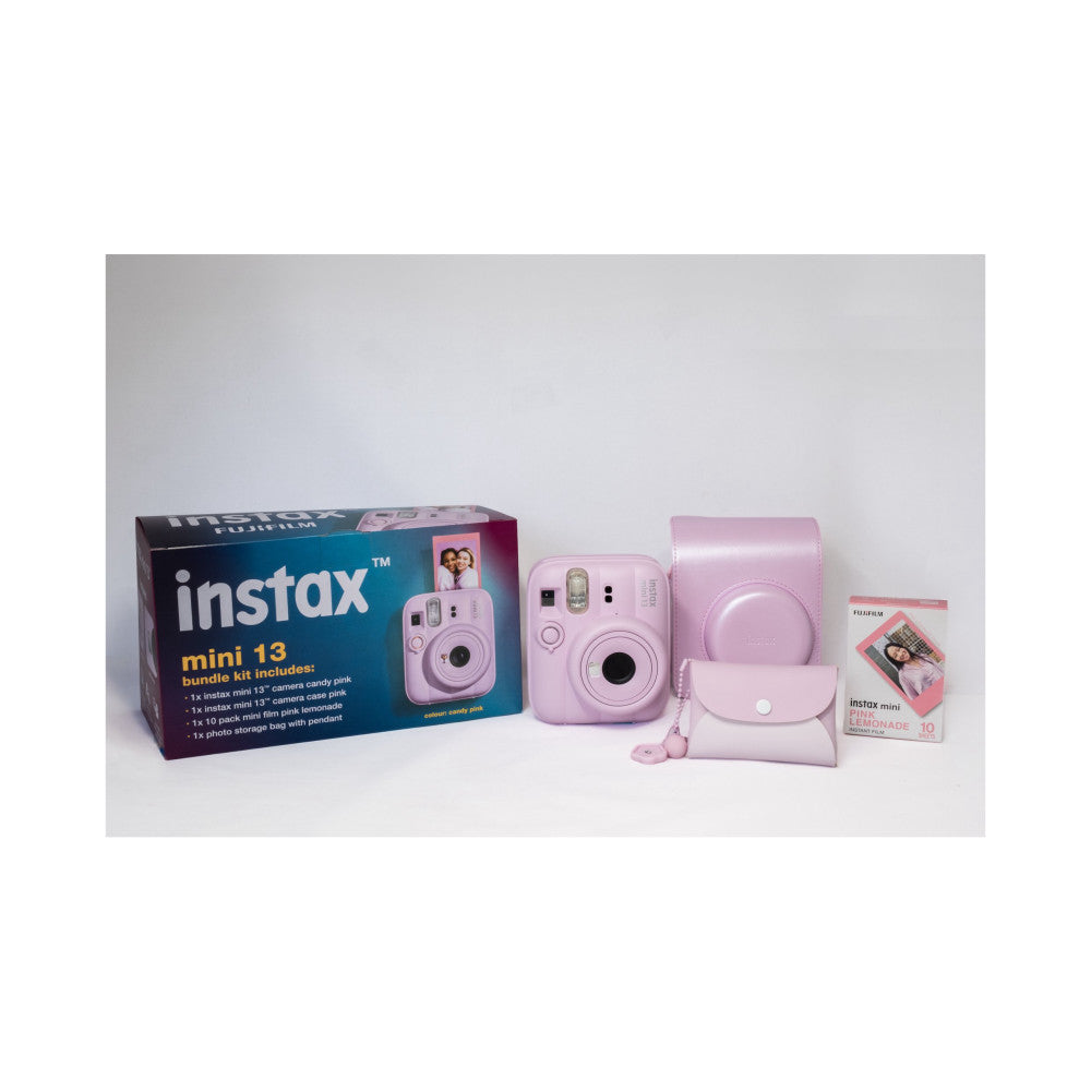 Fujifilm Instax Mini 13 bundle kit in sandy pink displayed with camera, case, film box, and accessories against white background.