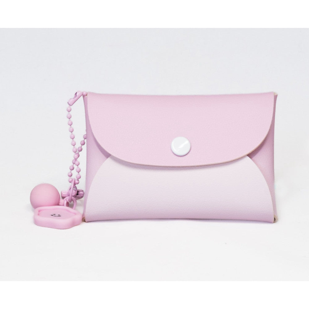 Pink Instax Mini 13 camera with matching case and beaded keychain charm displayed against white background.