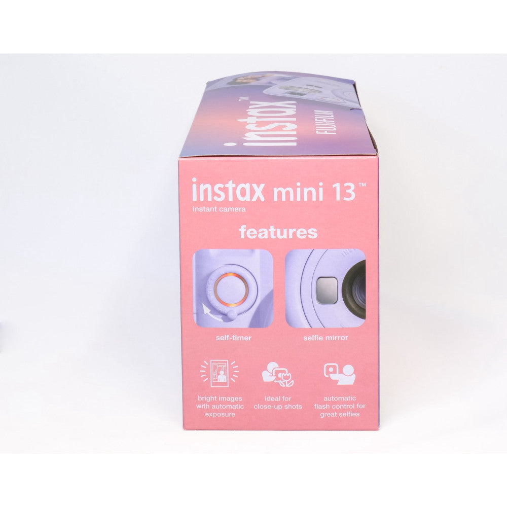 Instax Mini 13 camera box packaging showing front panel with product name, features including self-timer and selfie mirror, and benefits highlighted against pink background.