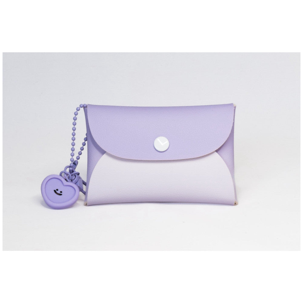 Purple and white camera case with snap closure and matching purple heart-shaped charm on beaded keychain, displayed against white background.