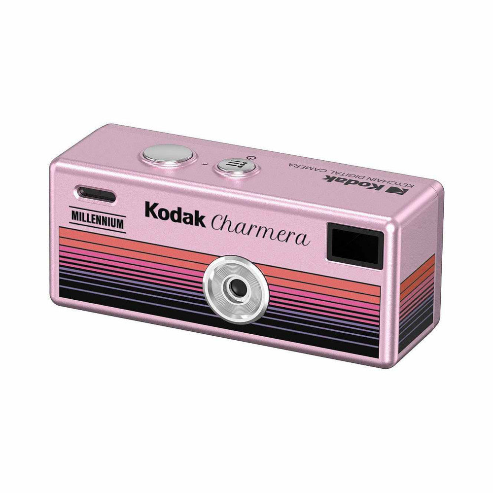 Pink Kodak Charmera Millennium digital camera shown from a three-quarter angle, displaying the lens, top controls, and colorful striped design.