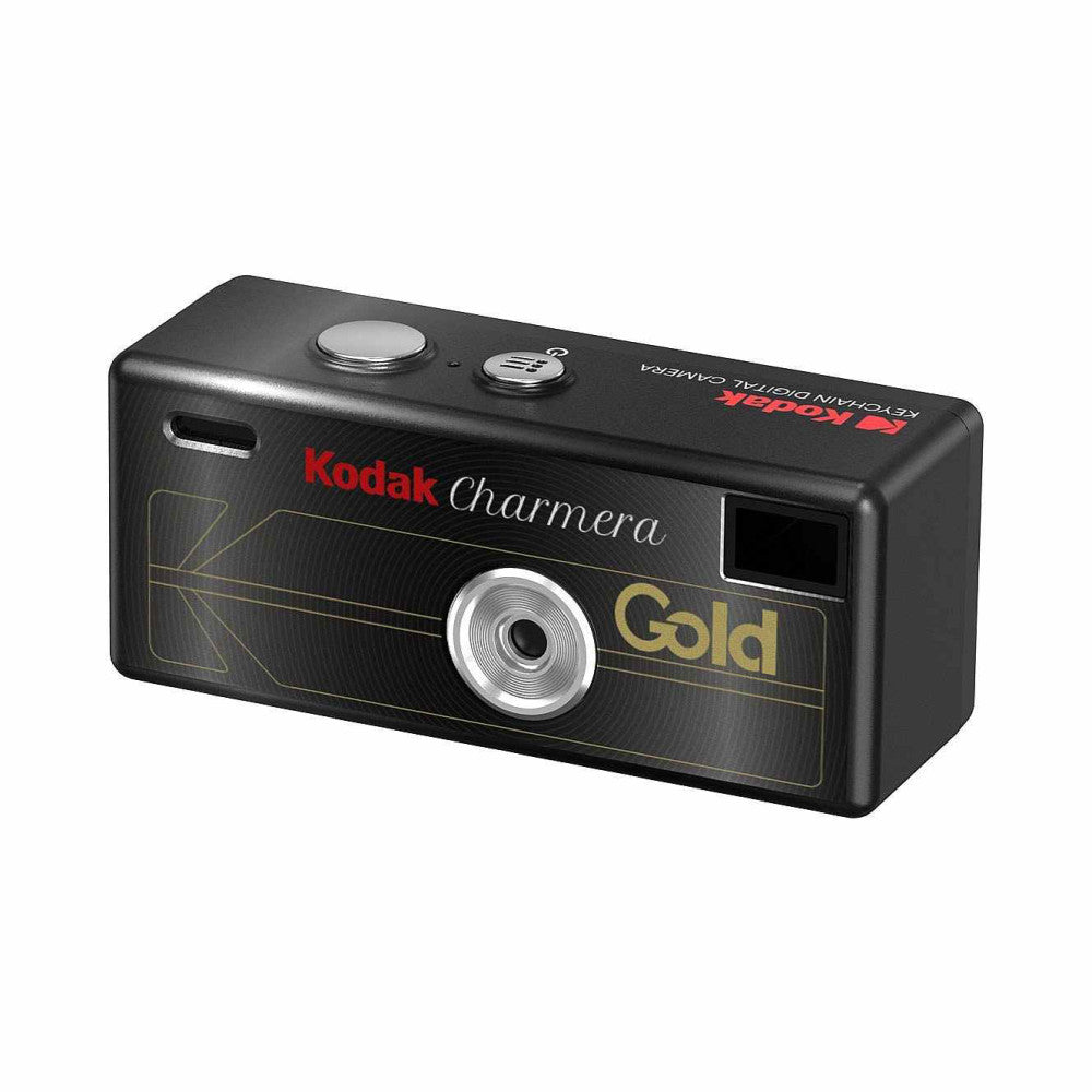 Black Kodak Charmera Gold compact digital camera shown from the front angle, featuring a silver lens ring and two control buttons on top.