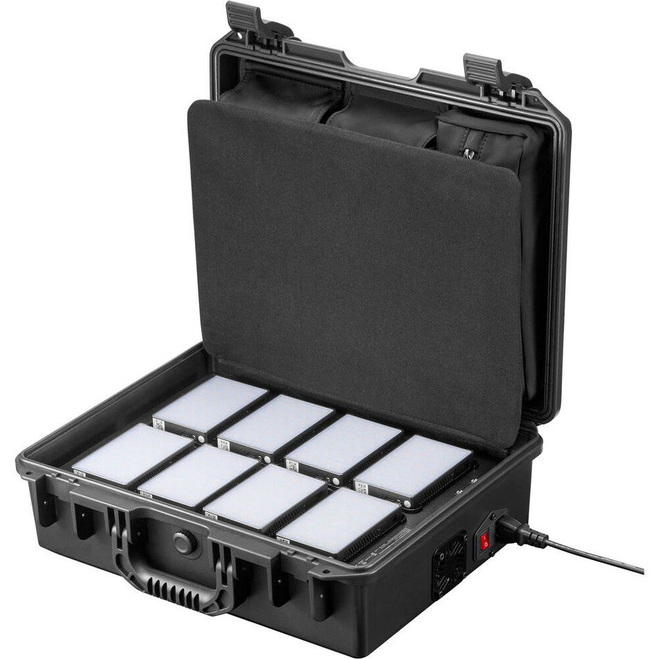 Open hard case displaying eight LED light panels with foam padding and cable, viewed from above at an angle