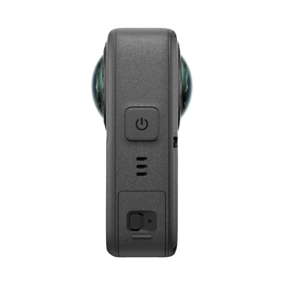 Rear view of DJI Osmo 360 II showing power button, microphone ports, and camera lens housing against black background.