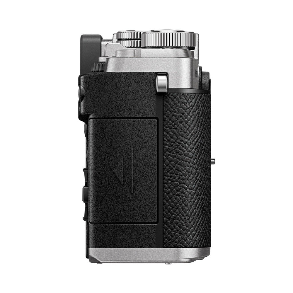 Side view of OM System PEN silver camera body with black textured grip and metal accents, showing lens and top controls.