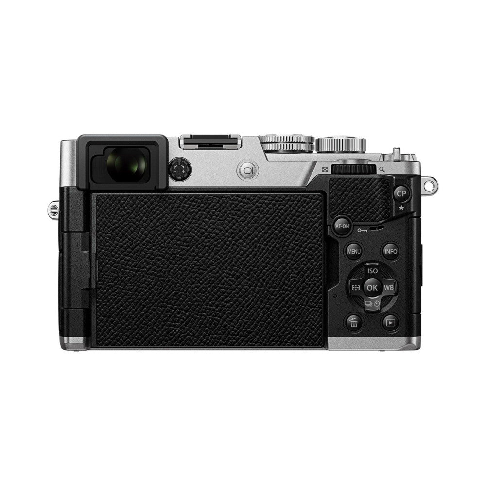 Rear view of OM System PEN Body Silver mirrorless camera showing LCD screen and control buttons on black textured back panel.