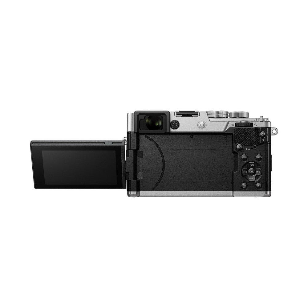 Rear view of silver and black compact camera with articulating screen extended to the left, showing control buttons and LCD display on back panel.