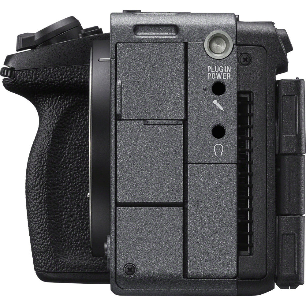 Rear three-quarter view of black Sony FX5 cinema camera showing textured body, grip handle, control buttons, and articulating screen on right side.