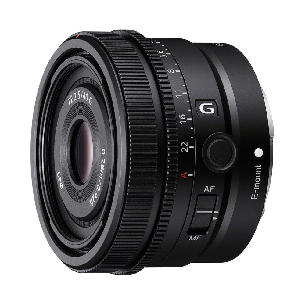 Black Sony FE 40mm f/2.5 G lens shown from front-left angle, displaying the front lens element, focus ring, aperture scale, and control buttons on the barrel.