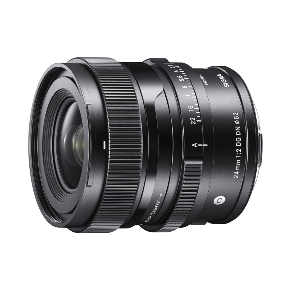 Black camera lens shown at three-quarter angle against white background, displaying focus ring and aperture markings on barrel.