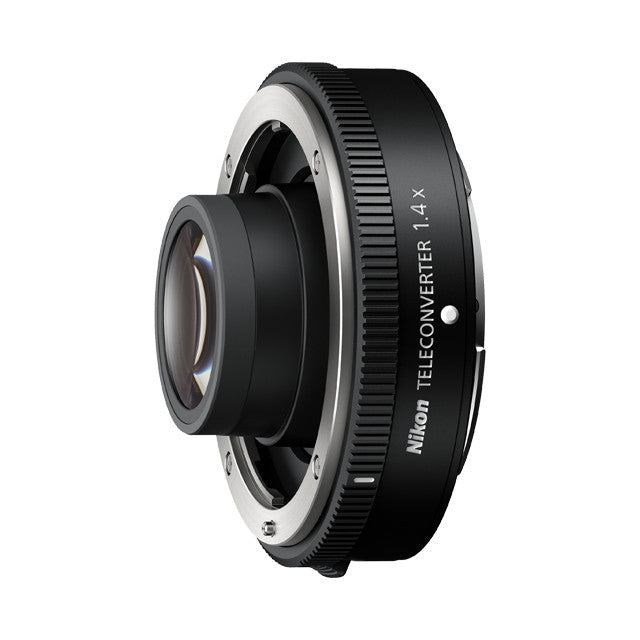 Nikon Z TC-1.4x Teleconverter shown at an angle, displaying the lens barrel with text branding and the rear bayonet mount against white background.
