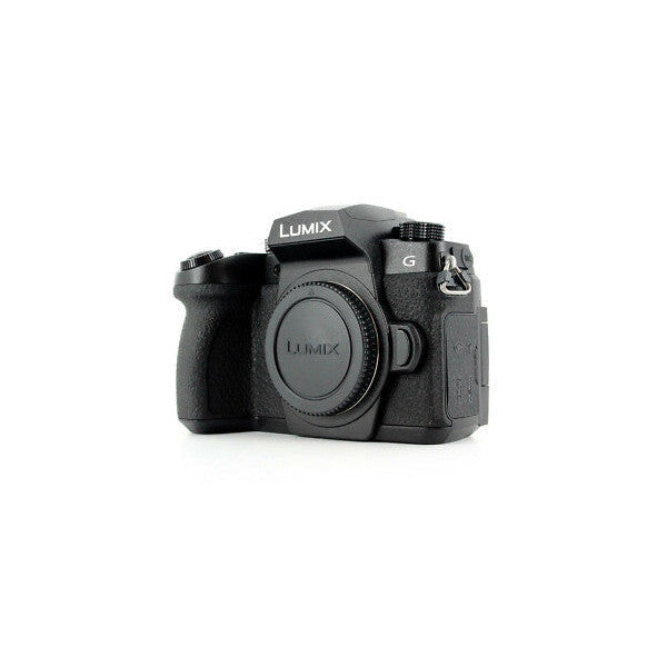 Black Panasonic Lumix G90 mirrorless camera body shown from front three-quarter angle against white background