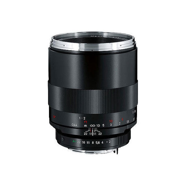 Black Zeiss macro lens shown from front angle against white background, displaying focus ring, aperture markings, and metal mount.