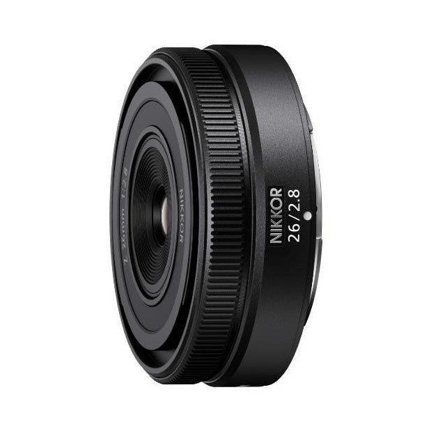 Side view of Nikon Z 26mm f/2.8 lens showing barrel, focus ring, and product markings against white background.