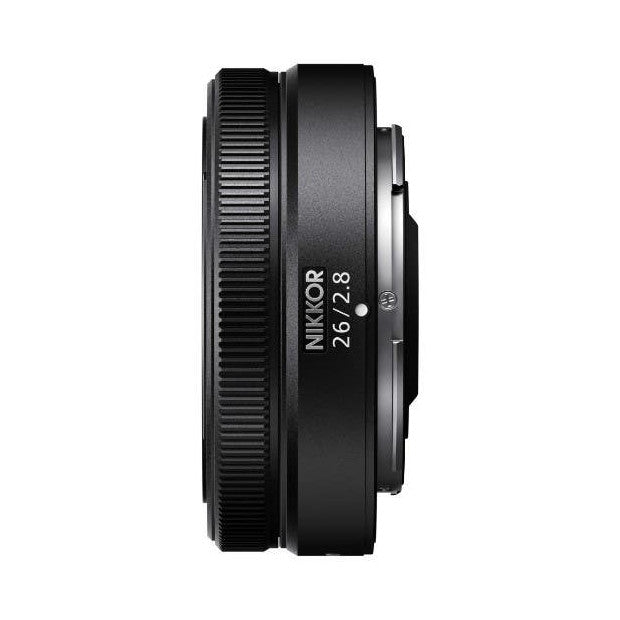 Side view of Nikon Z 26mm f/2.8 lens showing barrel, focus ring, and lens markings on black background
