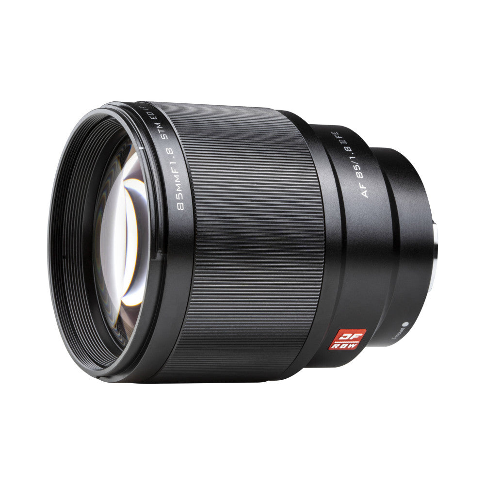 Black telephoto lens shown at three-quarter angle displaying front element, barrel with specifications text, and red manufacturer badge.