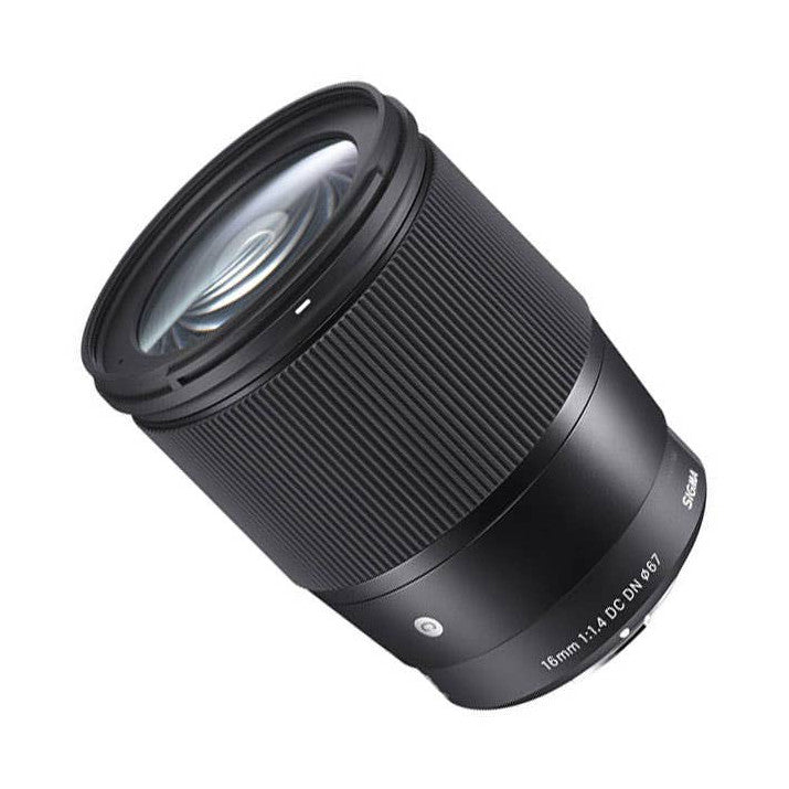 Black Sigma 16mm f/1.4 lens with textured barrel, shown at an angle against white background displaying front element and focus ring markings.