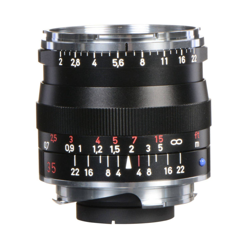 Black vintage-style manual focus lens shown from front angle, displaying aperture ring, focus scale, and depth-of-field markings against white background.