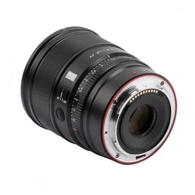 Rear three-quarter view of a black Viltrox AF 27mm F1.2 PRO lens with red ring accent, showing mount and focus scale details against white background.