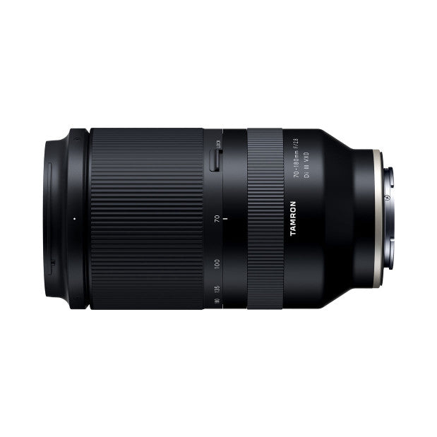 Black telephoto zoom lens shown from side angle against white background, displaying barrel, focus ring, and Sony FE mount