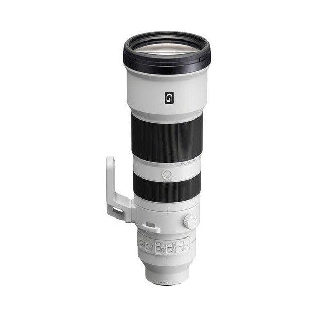 White and black telephoto zoom lens shown from side view against white background, displaying barrel, focus ring, and tripod collar.