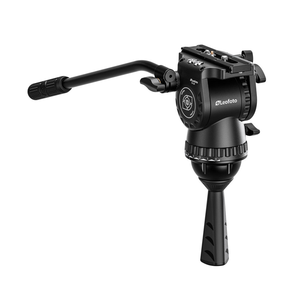 Leofoto FH-20 fluid video head shown from the side with pan handle extended, mounted on tripod legs, displaying the head's pan-tilt mechanism and control dial.