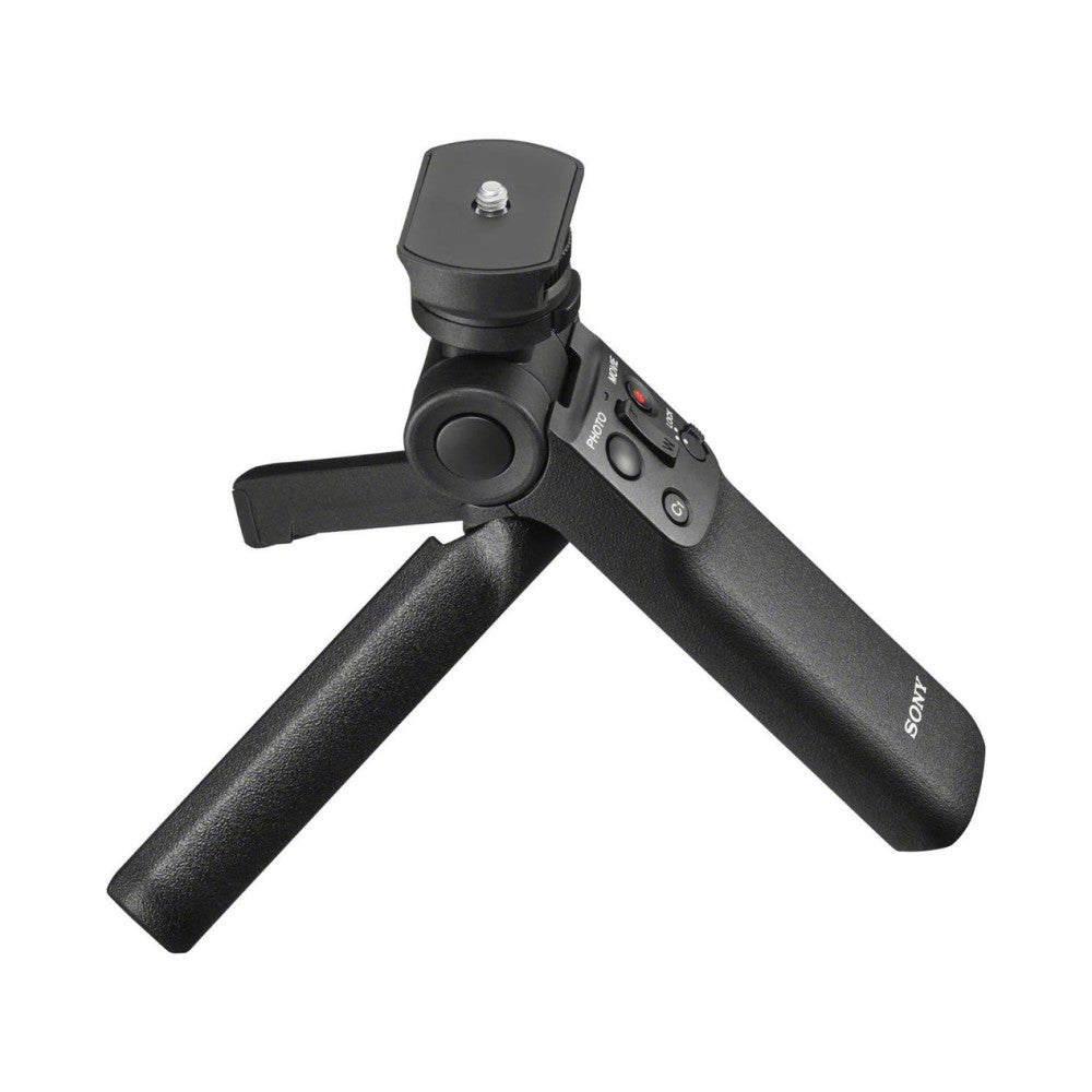 Black Sony GP-VPT2BT shooting grip with tripod legs extended, shown from angled side view against white background.