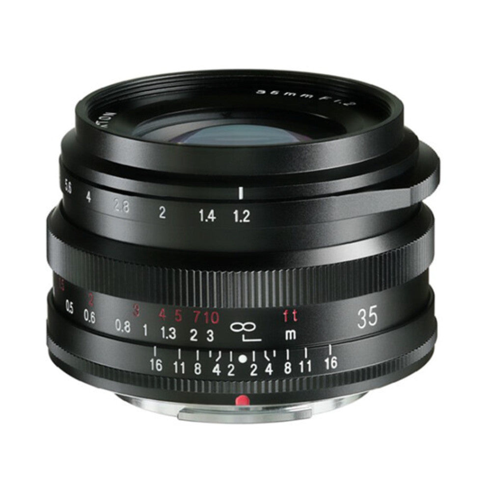 Black manual focus lens shown from front angle, displaying aperture ring (f/1.2-f/16), focal length markings (35mm), and focus distance scale with depth of field indicators.