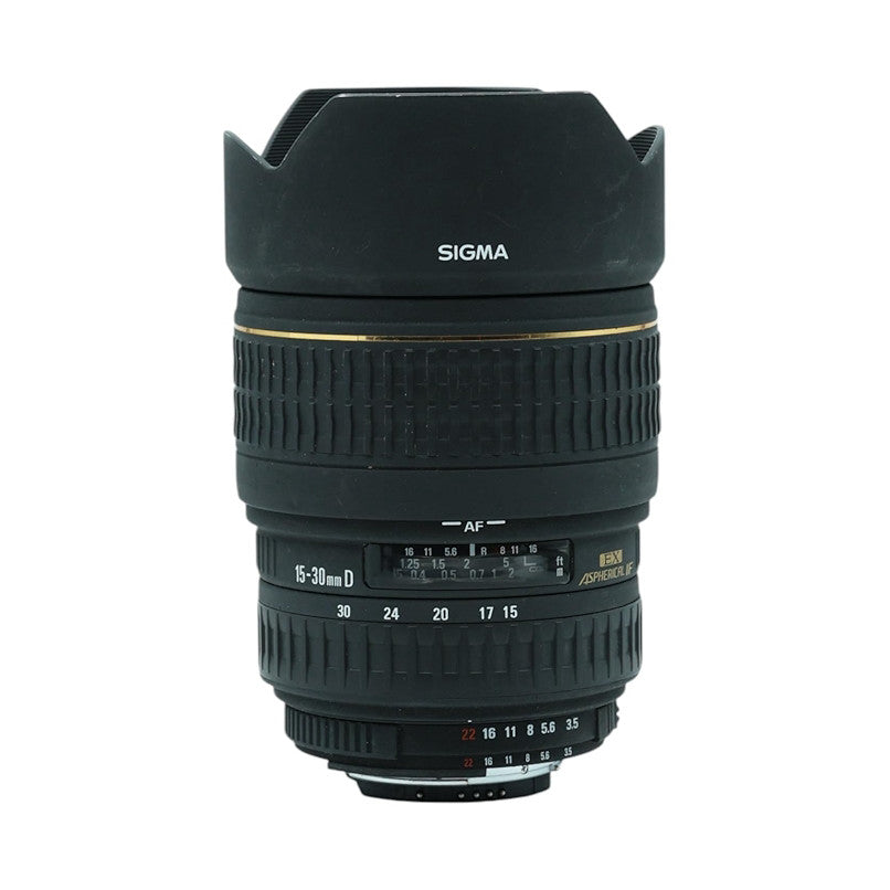 Black Sigma wide-angle zoom lens with hood displayed against white background, showing front view with focal length markings and AF indicator visible.