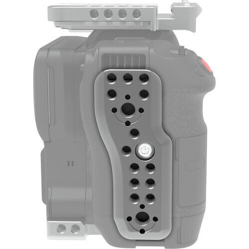 Side view of a gray camera mounting plate with multiple black threaded holes and one white adjustment knob, attached to a professional video camera body.
