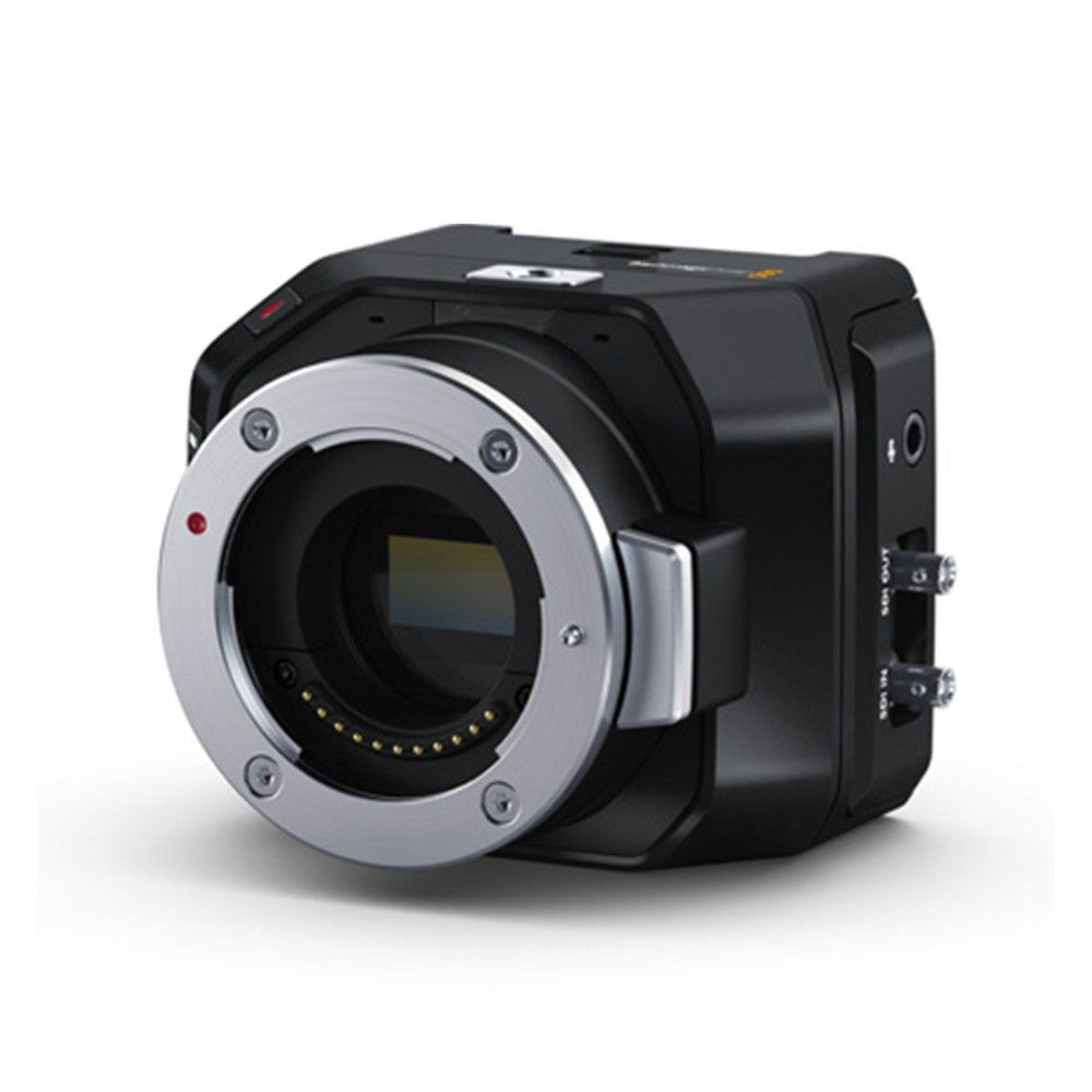 Black compact studio camera with silver lens mount and black body shown at three-quarter angle against white background.
