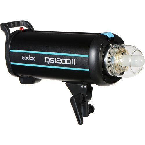 Black cylindrical studio flash with cyan trim and handle, shown from side angle with flash head visible on right end.
