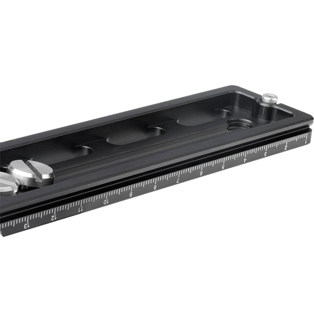 Black Arca-type quick release plate shown at an angle, displaying the measurement scale along its length and mounting slots on top surface.