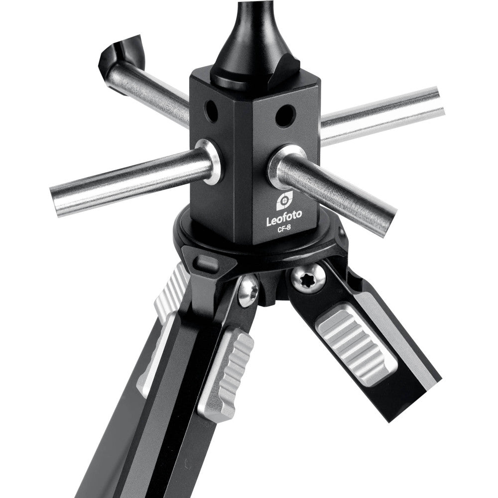 Leofoto CF-8 mounting adapter shown from front angle with four metal rods extended horizontally and cone-shaped top piece, mounted on tripod legs below.