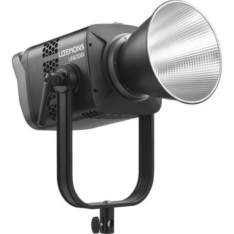 Front three-quarter view of black LED spotlight with reflector dish and mounting bracket against white background.