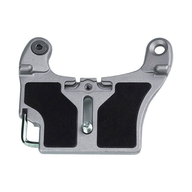 Gray and black camera mounting plate with two black grip pads, adjustment screw in center, mounting holes on sides, and metal attachment pin on left edge, shown flat against white background.