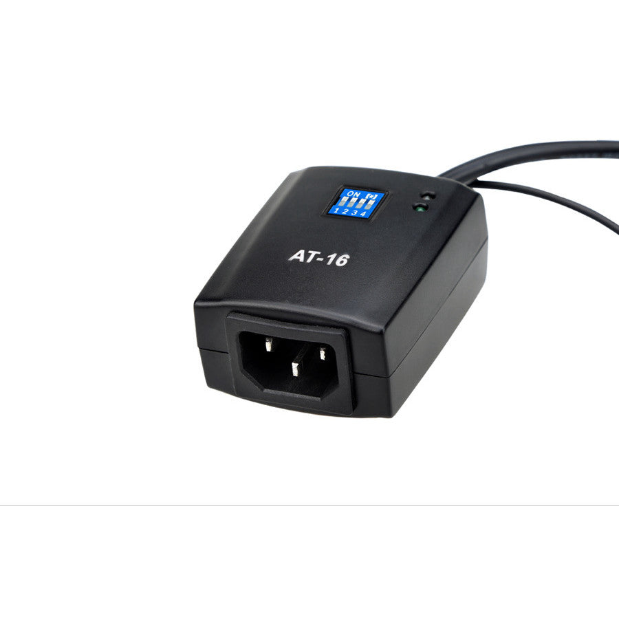 Black Godox AT-16 AC trigger receiver shown from front angle with power cable attached and blue LCD display visible on top.