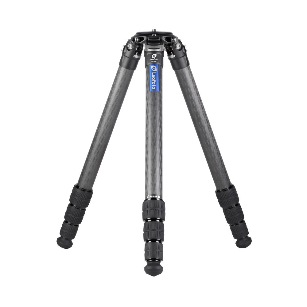 Front view of a black carbon fiber tripod with extended legs, showing the central column, ball head mount, and textured grip sections on the legs.