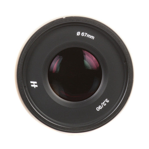 Front view of a black Hasselblad XCD 90mm f/3.2 lens showing the 67mm diameter barrel and glass elements.