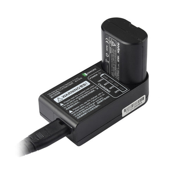 Godox C20 charger with battery mounted on top, shown from angled side view with power cord visible against white background.