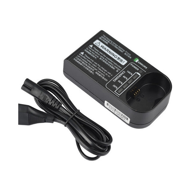 Black Godox C20 battery charger shown at an angle with power cord coiled on left side, displaying warning label and charging contacts on top.