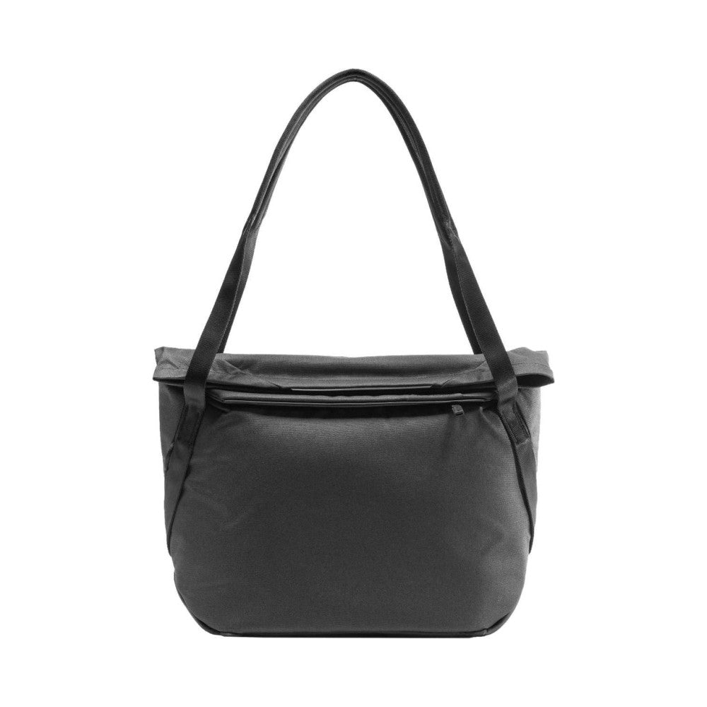 Front view of a black fabric tote bag with rolled top closure and dual shoulder straps against a white background.