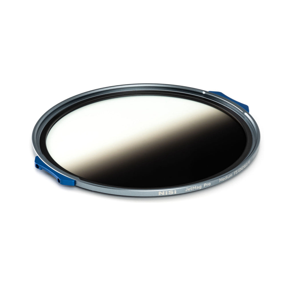 Angled top-down view of a circular magnetic filter with gray and black rim, blue quick-release tabs, and graduated gray-to-clear glass surface.