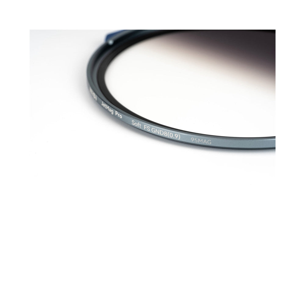 Close-up of a curved magnetic filter ring showing text engraved on the edge, displaying product specifications against a white background.