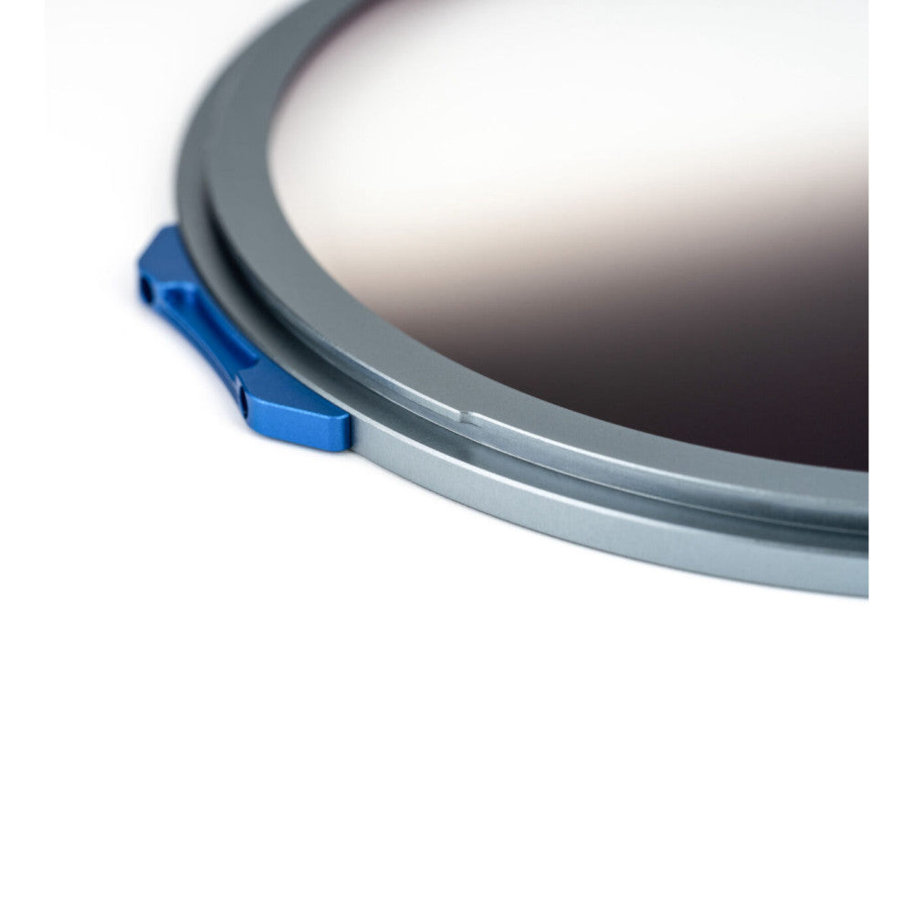 Close-up detail of NiSI JetMag Pro magnetic filter ring showing gray frame with blue metal clip attachment on white background.